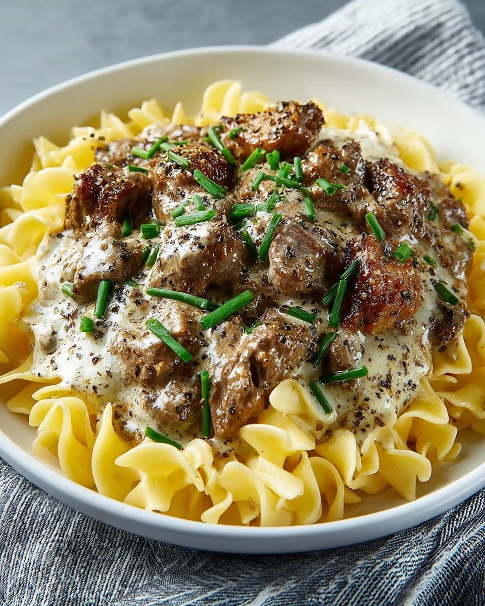 Classic Beef Stroganoff with tender beef and creamy sauce over egg noodles