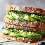 Mediterranean avocado chicken salad with fresh ingredients and vibrant colors