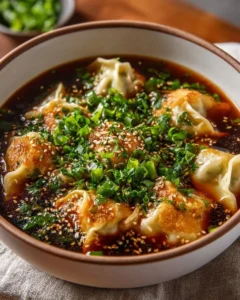 Bowl of flavorful Potsticker Soup with dumplings and fresh vegetables