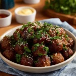 Slow Cooker Spicy Orange Marmalade Meatballs served in a bowl