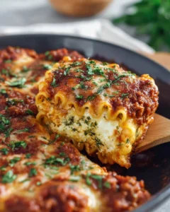 A delicious plate of Sausage and Spinach Lasagna Rolls topped with melted cheese