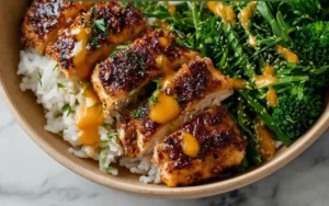 Delicious sticky chicken rice bowls with vibrant ingredients and sauce