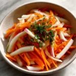 Banh Mi sandwich featuring colorful pickled vegetables for a fresh taste