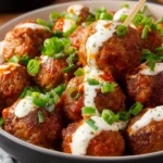 Crock Pot Buffalo Ranch Meatballs served in a bowl with a side of dipping sauce