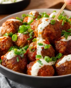 Crock Pot Buffalo Ranch Meatballs served in a bowl with a side of dipping sauce