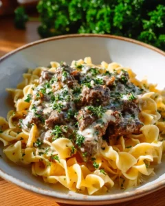 A delicious bowl of easy ground beef stroganoff served with pasta.