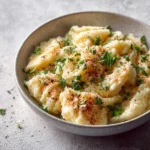 Bowl of Easy Tortellini Alfredo with creamy sauce and herbs