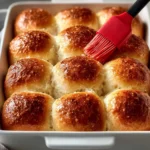 Freshly baked homemade dinner rolls arranged on a plate