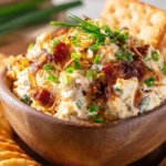 Delicious Neiman Marcus Dip served with tortilla chips and fresh vegetables.