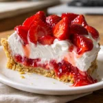 Easy Strawberry Cool Whip Pie topped with fresh strawberries and whipped cream