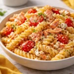 Creamy garlic baked feta salmon pasta in a bowl