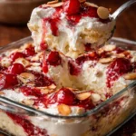 Heaven On Earth Cake with layers of cream, fruit, and cake for a heavenly dessert experience.