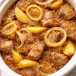 Slow Cooker Pork Loin with Sauerkraut and Apples dish garnished and ready to serve.