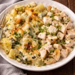 Delicious Spinach Artichoke Au Gratin Potatoes served in a dish