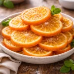 Delicious homemade candied oranges in a glass jar