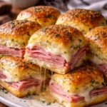 Easy ham and swiss sliders on a baking tray ready to be served