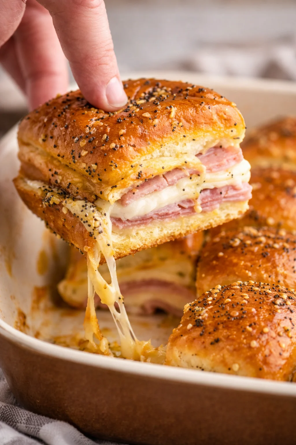 Delicious ham and cheese sliders ready to serve on a platter