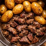 Slow Cooker Garlic Butter Beef Bites garnished for an appetizing presentation.
