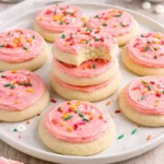 Delicious soft frosted sugar cookies with colorful icing on a plate