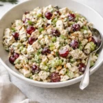 Delicious homemade chicken salad with fresh vegetables and herbs