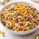Colorful bowl of bold flavor-packed coleslaw with fresh vegetables