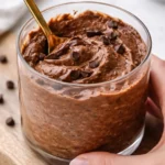 Delicious Brownie Batter Overnight Oats topped with chocolate and nuts