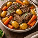 Delicious Crock Pot pot roast ready to serve with vegetables