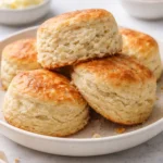 Fluffy sourdough discard biscuits fresh out of the oven, golden and flaky