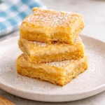 Delicious slice of Gooey Butter Cake showcasing its rich and creamy texture