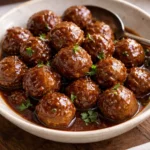 Delicious meatballs served with grape jelly and chili sauce for a savory snack