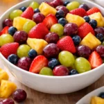 Colorful quick fruit salad with a variety of fresh fruits in a bowl