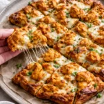 Delicious tandoori chicken garlic bread garnished with herbs
