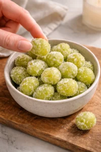 A variety of healthy snacks including fruits, nuts, and chips displayed on a table.