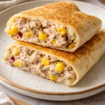 A delicious Tuna Melt Wrap filled with tuna, cheese, and fresh vegetables.