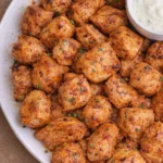 Healthy low carb buffalo chicken bites on a plate with dipping sauce