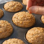 Freshly baked Banana Oatmeal Muffins on a wooden table