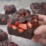 Delicious chocolate covered strawberry brownies on a plate