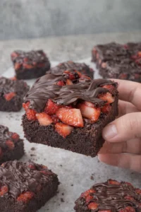 Delicious chocolate covered strawberry brownies on a plate