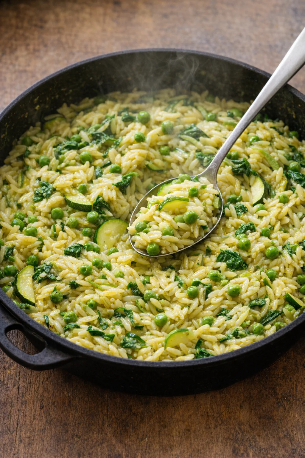 Bowl of Lemon Orzo with Zucchini topped with fresh herbs