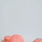 Delicious strawberry cake mix cookies on a plate with fresh strawberries