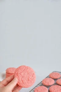Delicious strawberry cake mix cookies on a plate with fresh strawberries