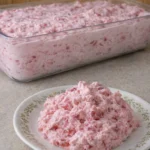 Delicious Strawberry Delight Dessert topped with fresh strawberries and whipped cream