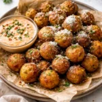 Crispy vegan potato balls served with Sriracha mayo dipping sauce