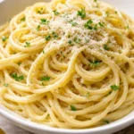 Delicious bowl of Garlic Parmesan Pasta garnished with parsley