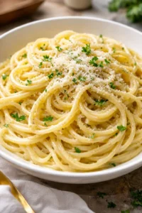 Delicious bowl of Garlic Parmesan Pasta garnished with parsley