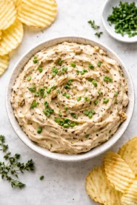 Brandied caramelized onion dip with a creamy texture served in a bowl