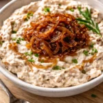 Delicious caramelized onion dip served in a bowl with tortilla chips