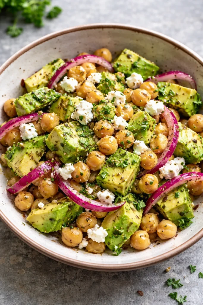 Chickpea Feta Avocado Salad with vibrant vegetables in a bowl