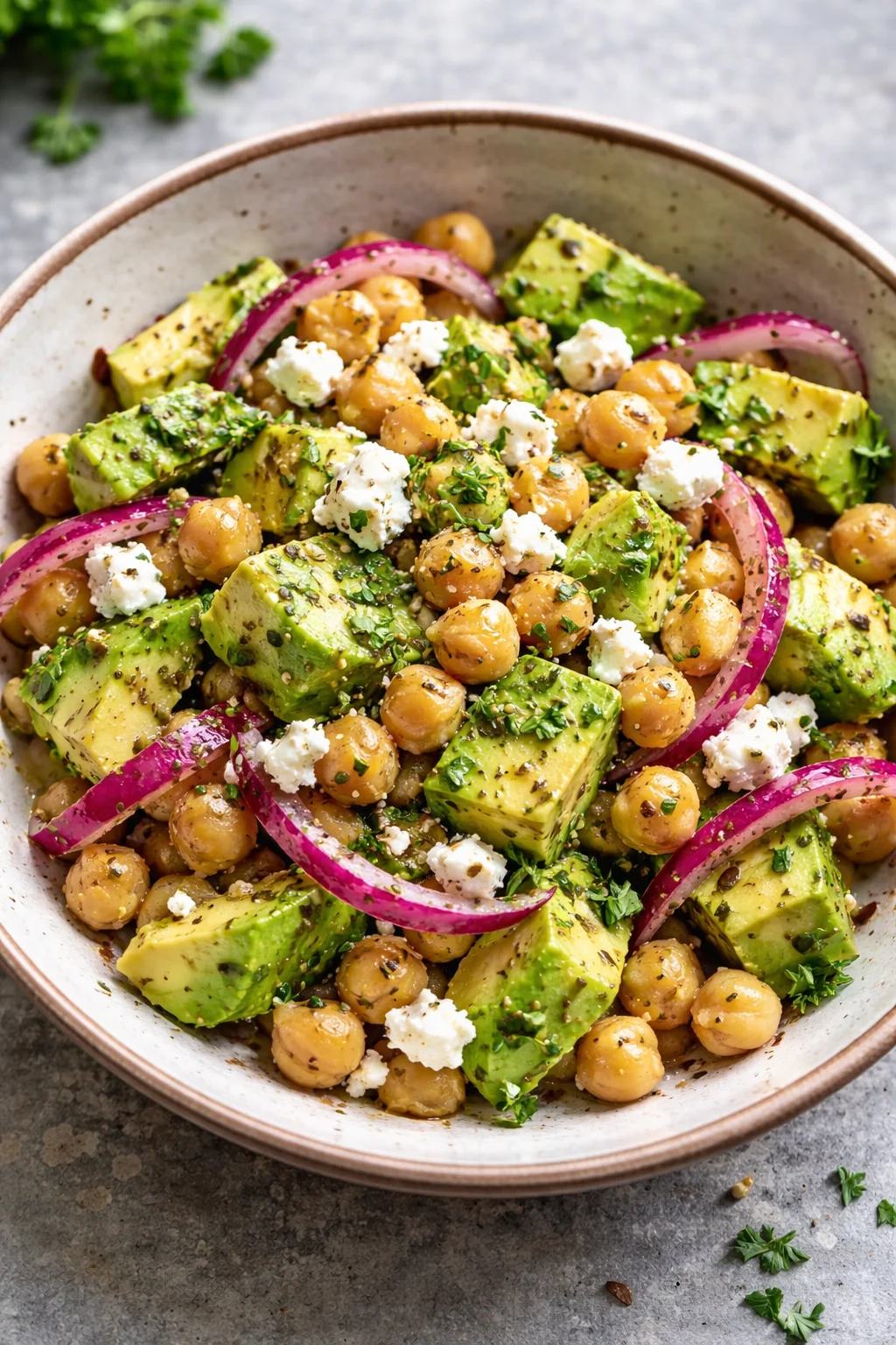 Chickpea Feta Avocado Salad with vibrant vegetables in a bowl