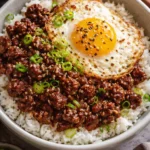 Delicious Korean ground beef bowl topped with vegetables and sesame seeds